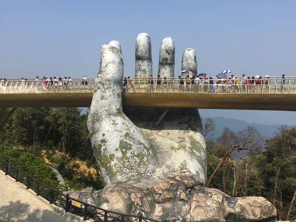 Ba Na Hills is a very popular attractions that attract most of the poeple where the pair of hand holding the golden bridge