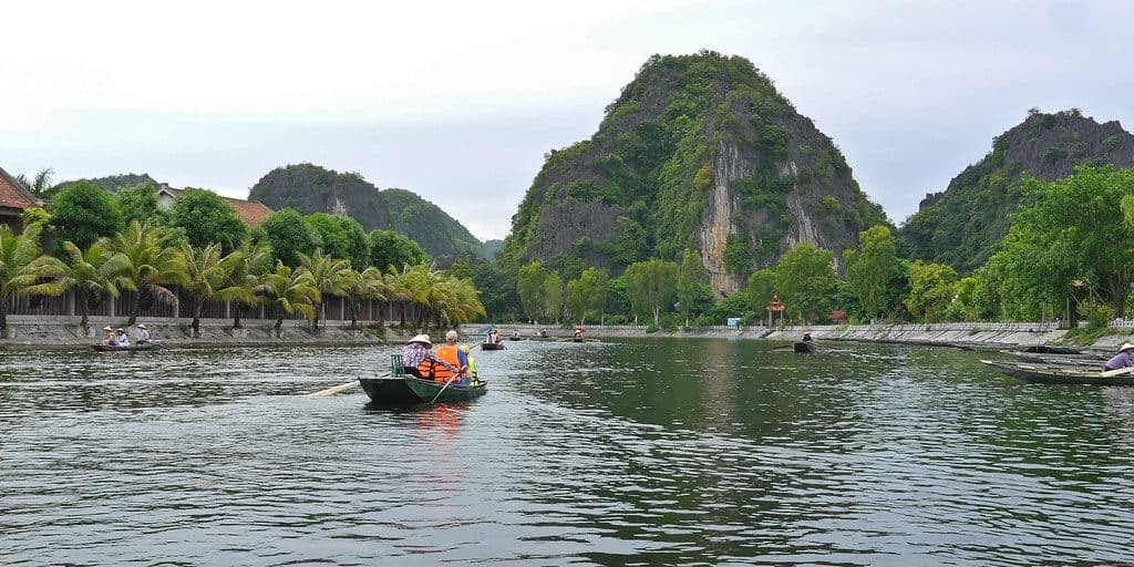 Hanoi and Tam Coc Tour - Tourist will sit on sampan boats to visit caves and countryside landscape