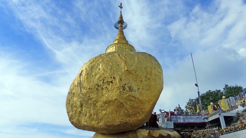Golden Rock where the pagoda is built on the top of a gilded rock leaning off the side of a clif 